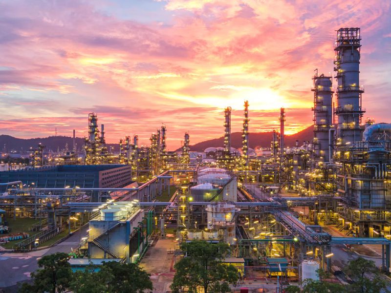 Aerial view Oil refinery.Industrial view at oil refinery plant form industry zone with sunrise and cloudy sky.Oil refinery and Petrochemical plant at dusk Thailand. Oil refinery background.